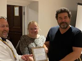 Jason James (owner) and staff member Gemma Phipps receive trophy from President Shaun Yeoman